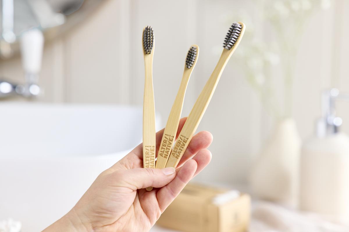 Bamboo brushes being held
