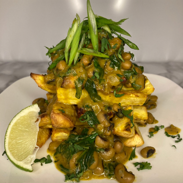 beans, greens and plantain stack on a plate