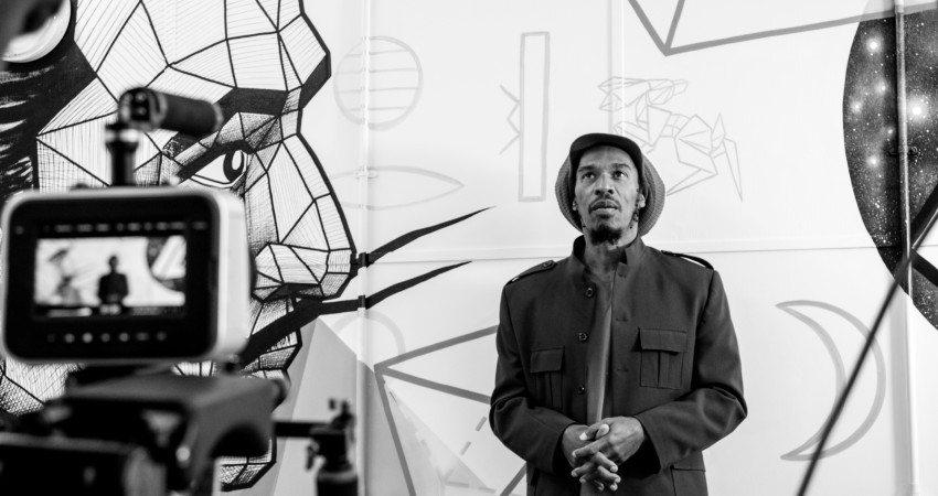 Black and white photograph of Benjamin Zephaniah in a studio