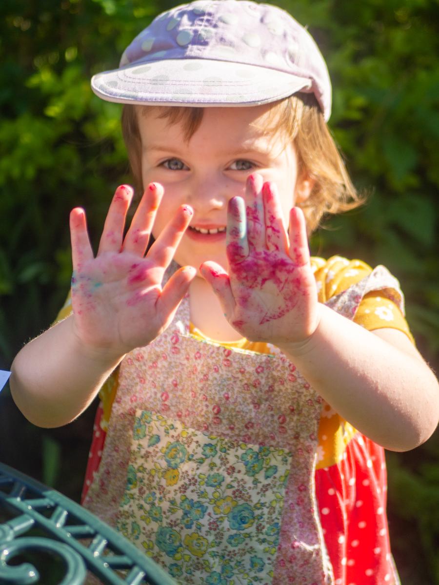 Photograph of Ayla finger painting