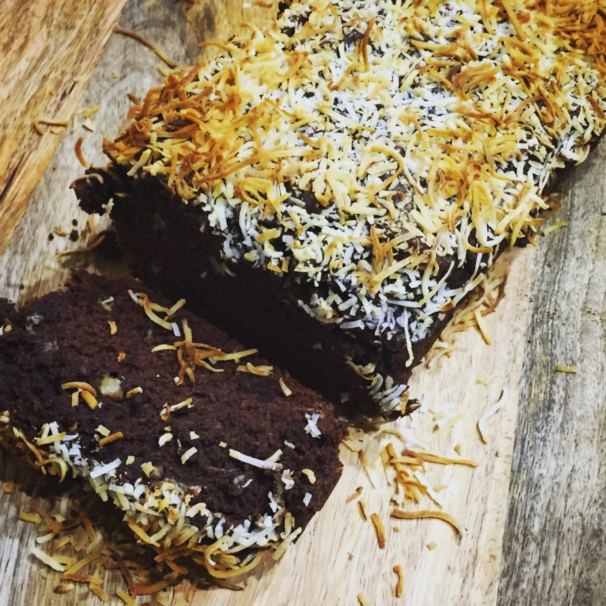 Vegan chocolate banana cake on a wooden table.