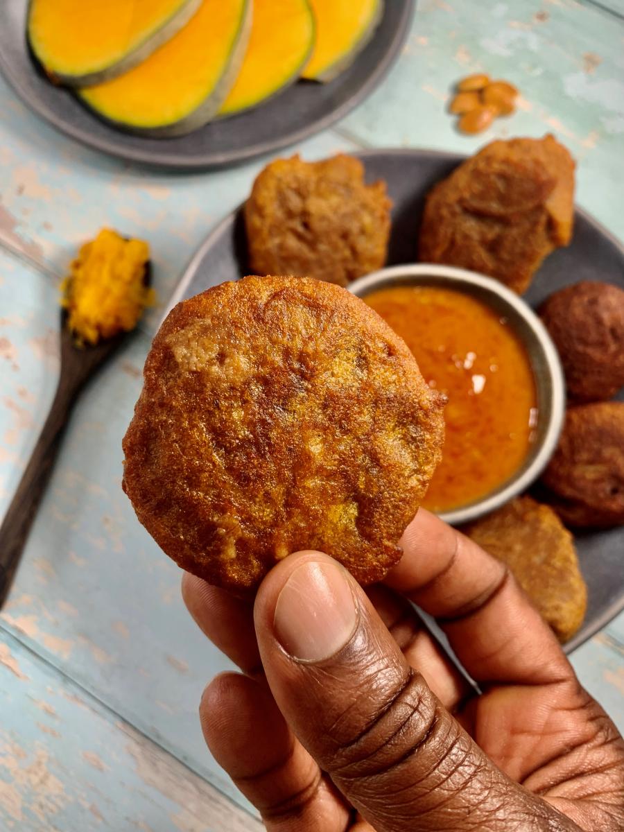 pumpkin fritters being held 