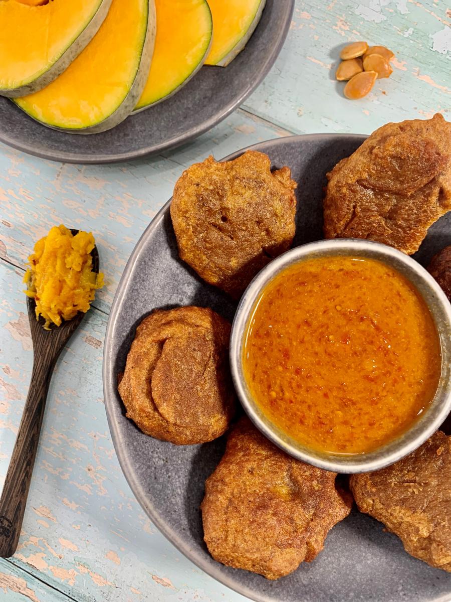 pumpkin fritters plated with sauce 