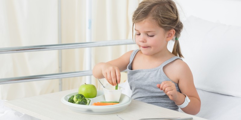 Child in hospital eating vegan food