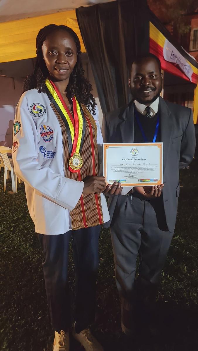 Kiggundu Ronald Reagan receiving a certificate