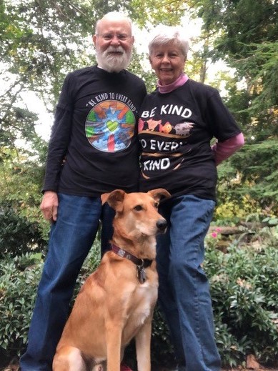 Michael and Loretta, wearing their vegan T-shirts, with their companion Luca