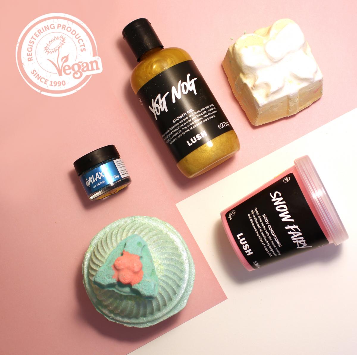 LUSH festive products against a pastel pink background