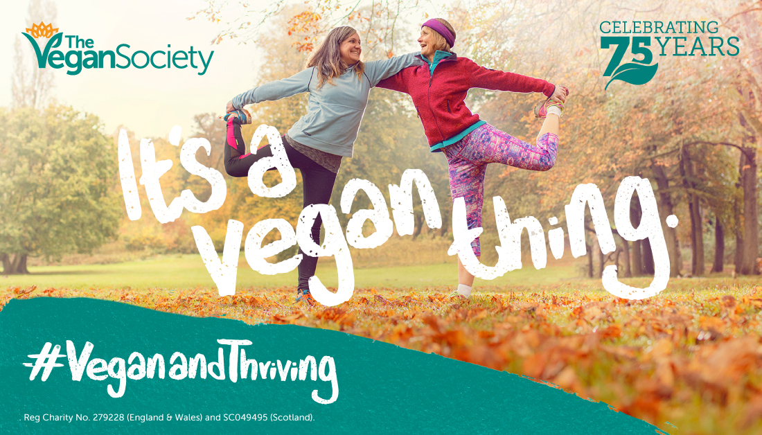 Two older women doing a yoga pose in an autumn park with 'it's a vegan thing' written over the top of the image