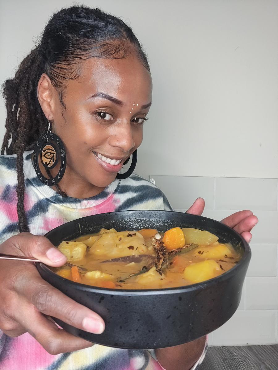 Ital Alex holding up a bowl of Saturday Soup