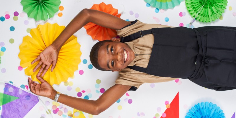 Omari Mcqueen portrait against a colourful background