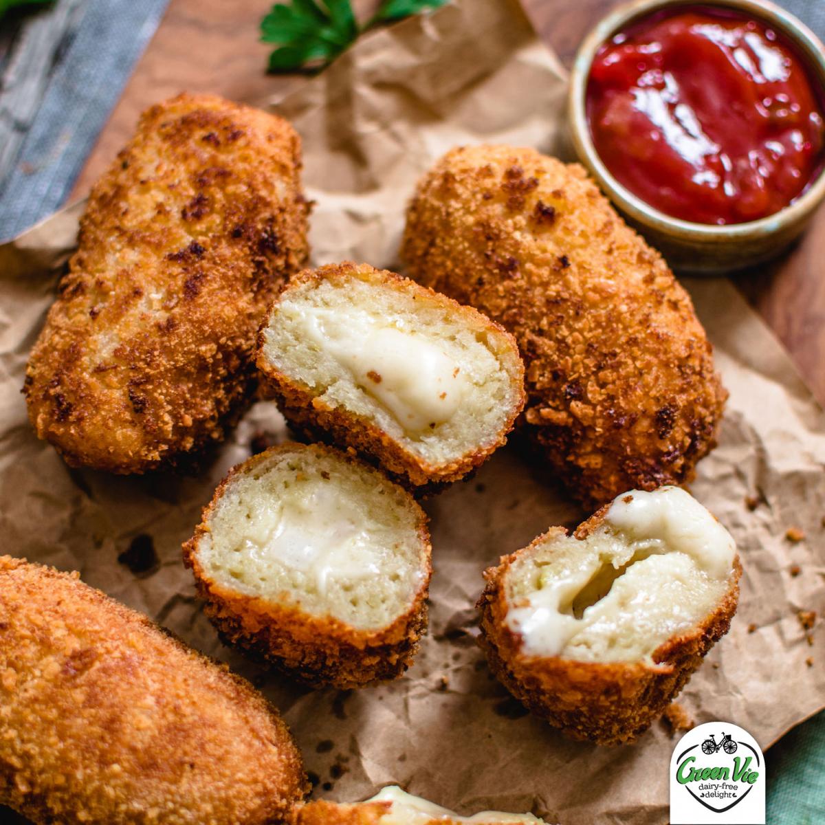 Close up of vegan cheesy potato croquettes