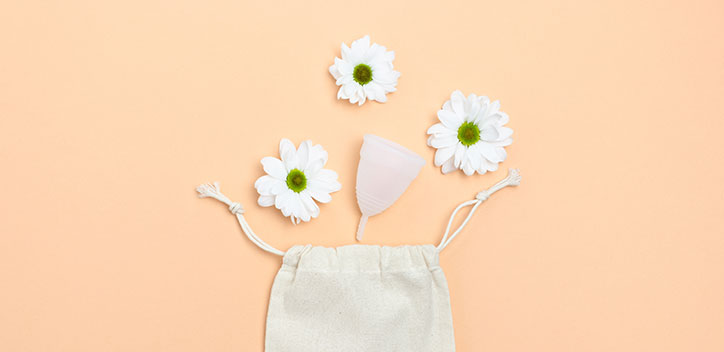 Mooncup and pouch surrounded by white flowers