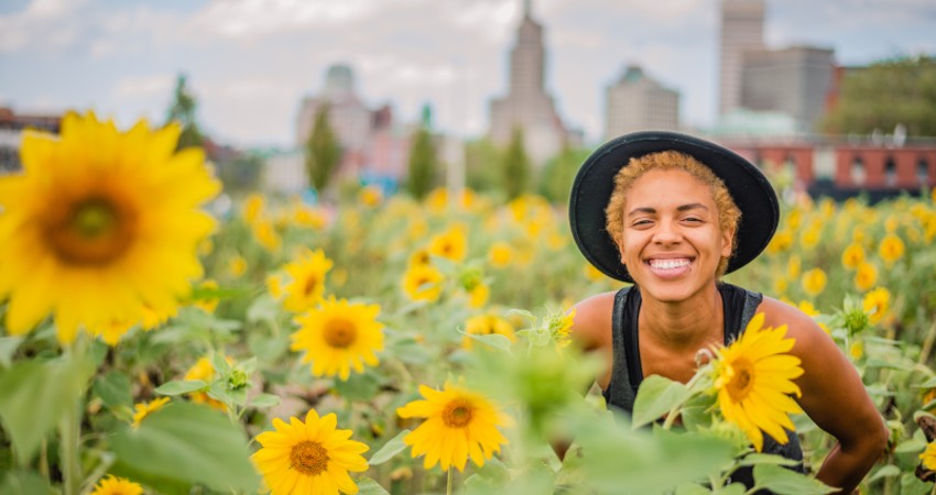 Person in sunflower field