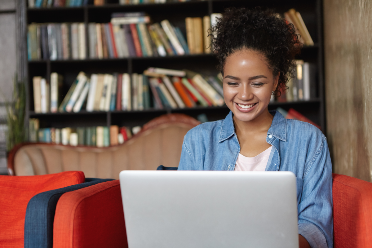 Person smiling at laptop