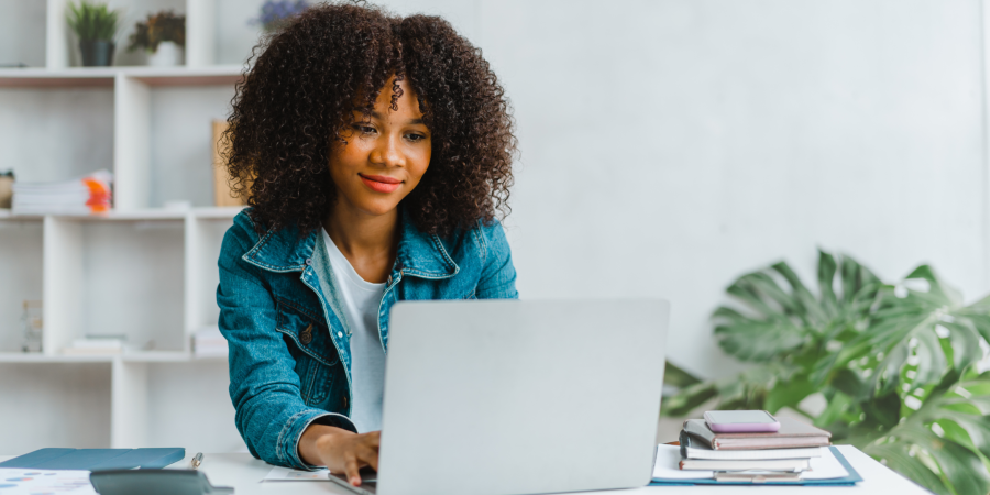 Person smiling using laptop