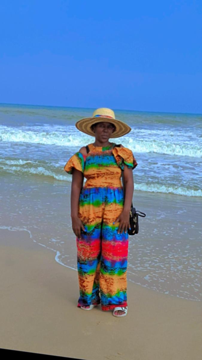 A woman enjoying the sun by the sea