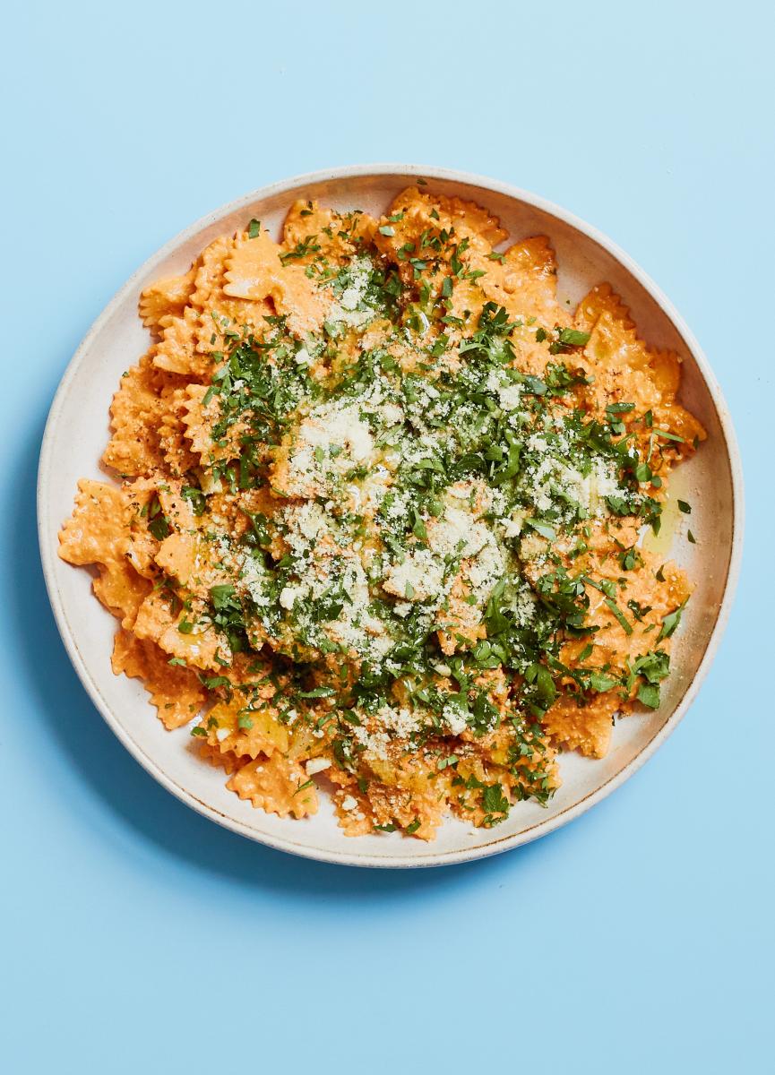 Red pepper pesto pasta served on a plate