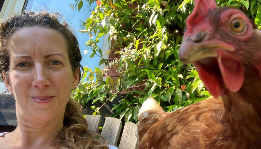 image of Charlotte and rescue hen together