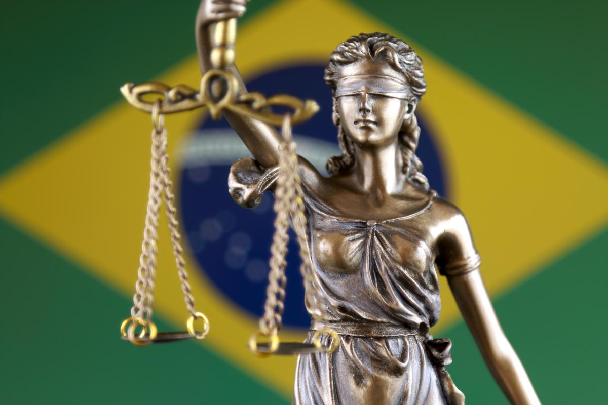 Symbol of law and justice with the Brazillian flag