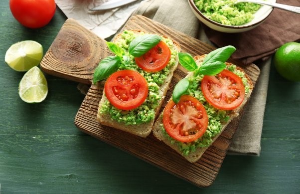 Tomato and avocado on toast: ensure you include a rainbow of plant foods in your balanced vegan diet