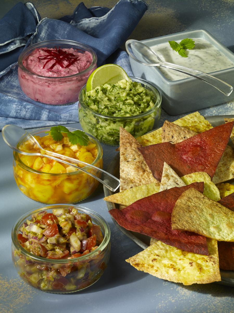 giant tortilla chips with rainbow dips 