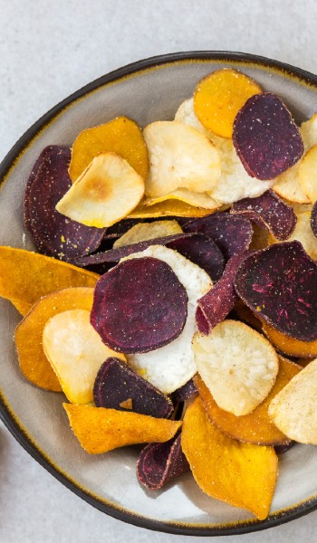 Vegetable crisps in a bowl photograph