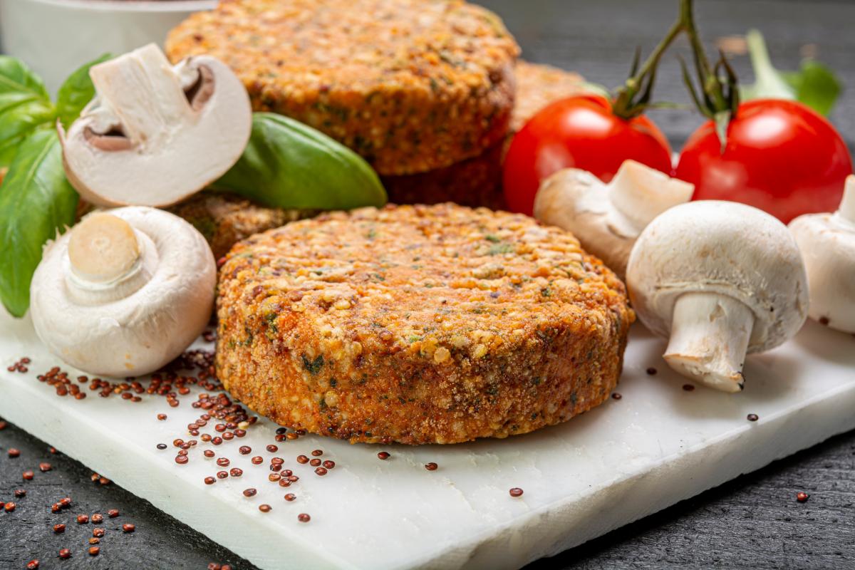 Tasty vegetarian and vegan burgers made from healthy quinoa, basil, tomatoes and champignon mushrooms 