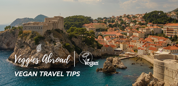 Image of Dubrovnik, Croatia. Veggies Abroad logo pictured with the Vegan Trademark logo. Text reads: Vegan Travel Tips