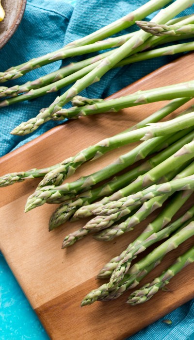 photo of asparagus against a blue background