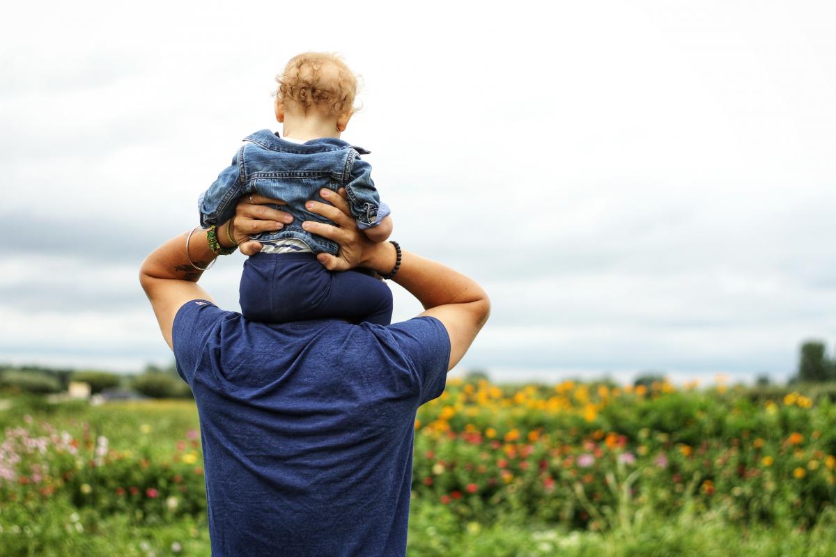 Baby Sitting on Man's Shoulder