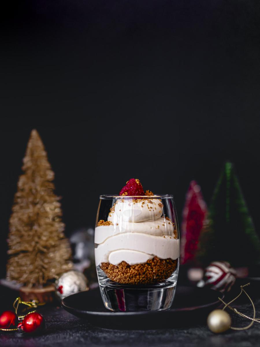 Vegan Baobab Cheesecake in a glass with festive background