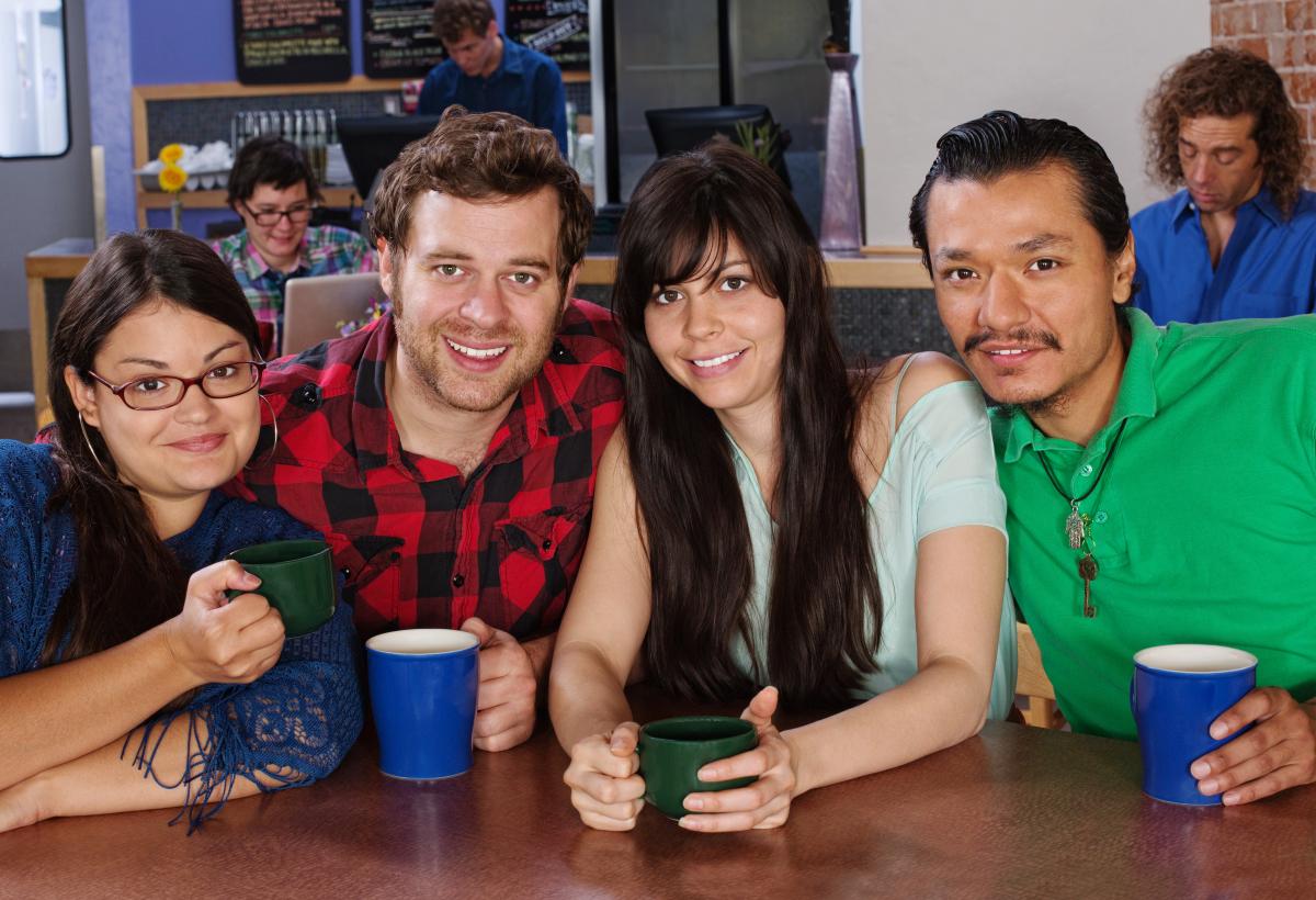 Four friends smiling