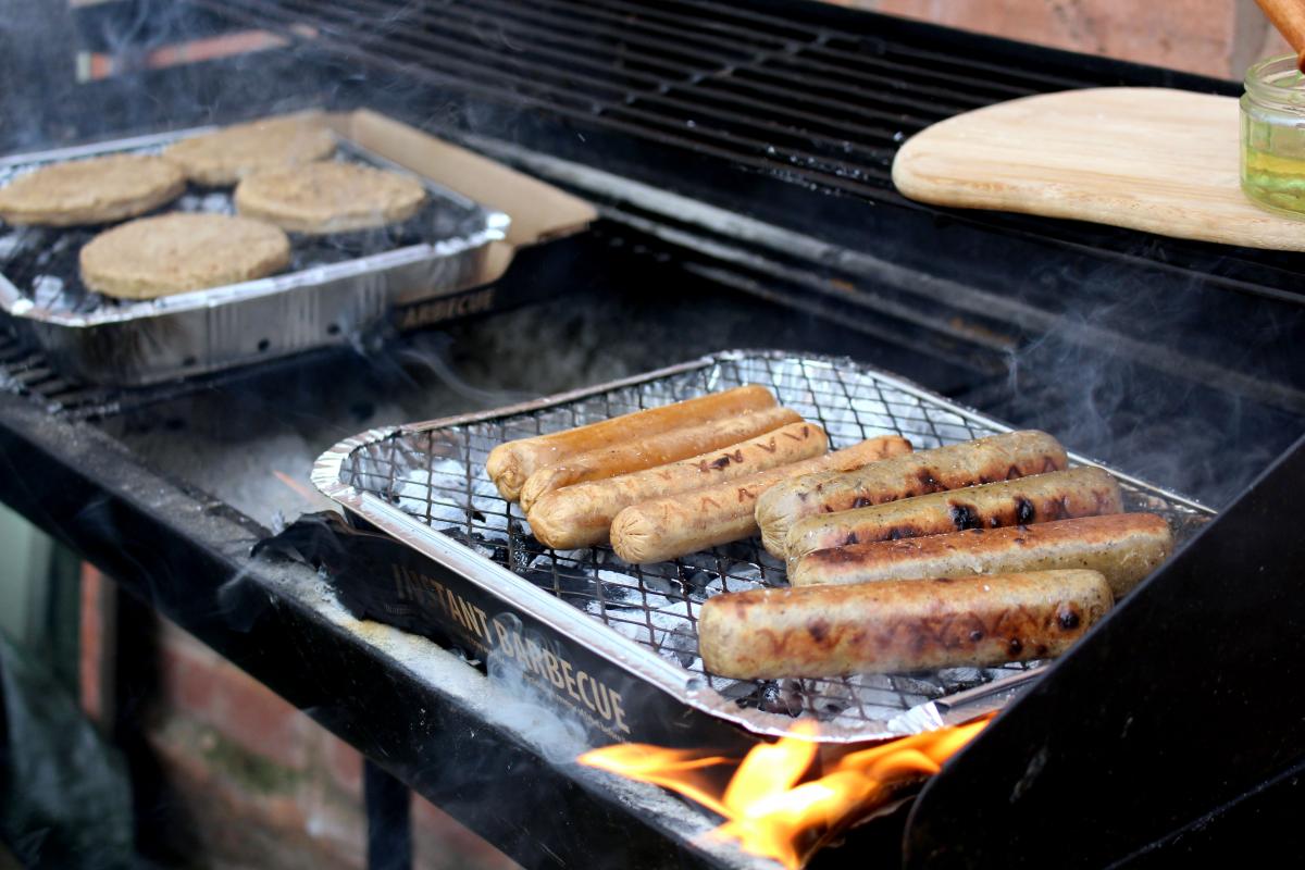 vegan sausages and burgers on bbq