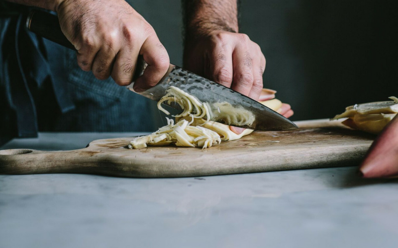 Hands chopping mushrooms - Wicked Healthy cookbook