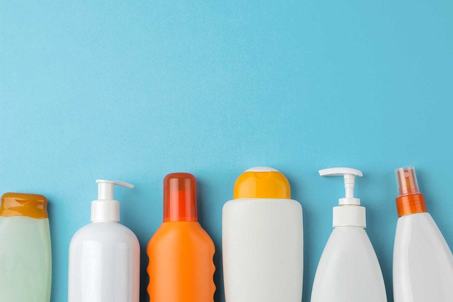 A collection of toiletries against a light blue background