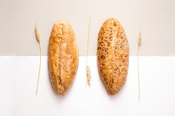 bread rolls next to wheat