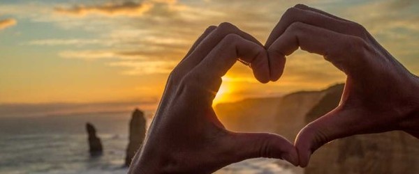 photograph of hands in the shape of a heart