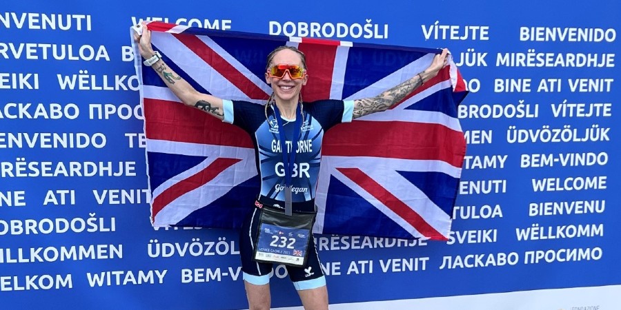 photo of Lisa Gawthrone holding up flag at European Duathlon Championship
