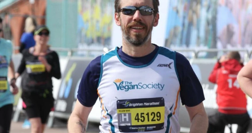 man running wearing Vegan Society vest