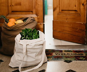 bag of vegetables by front door