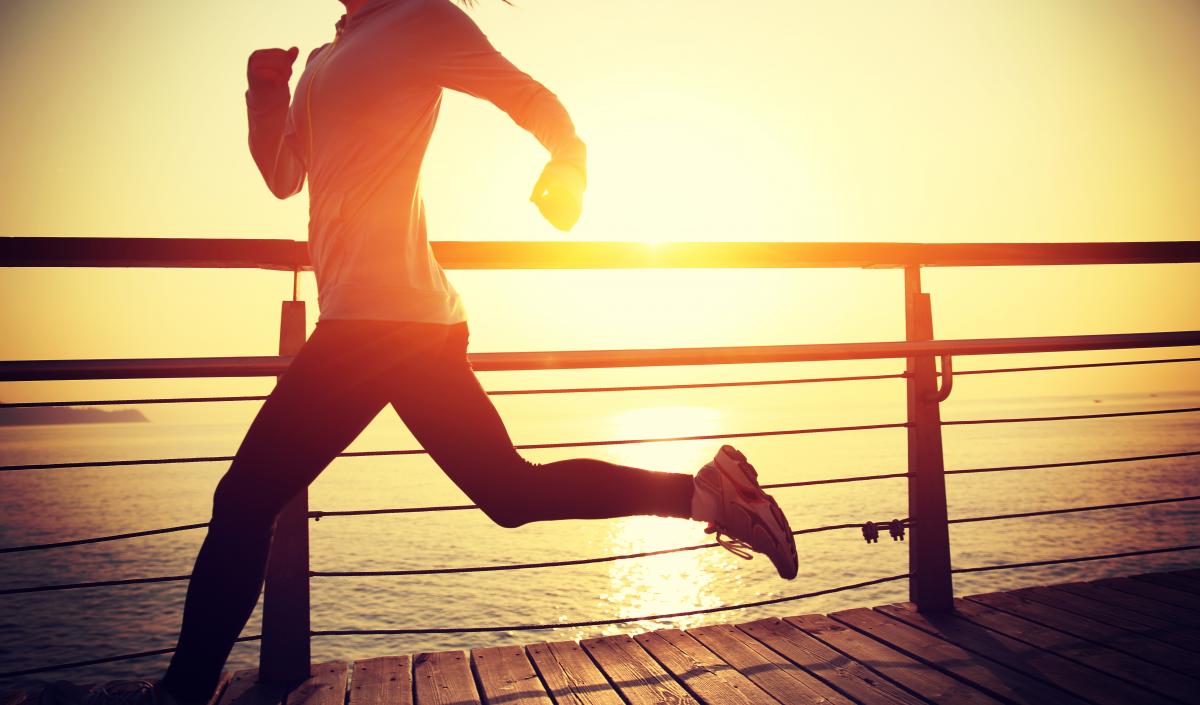 Woman running on pier