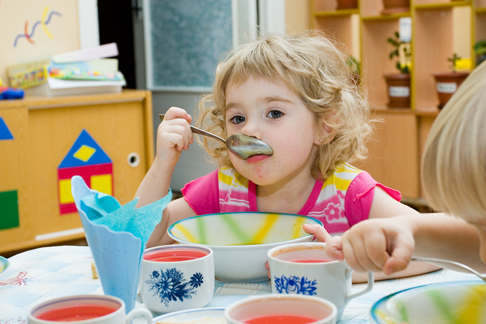 Young girl fed up with what she's eating and drinking